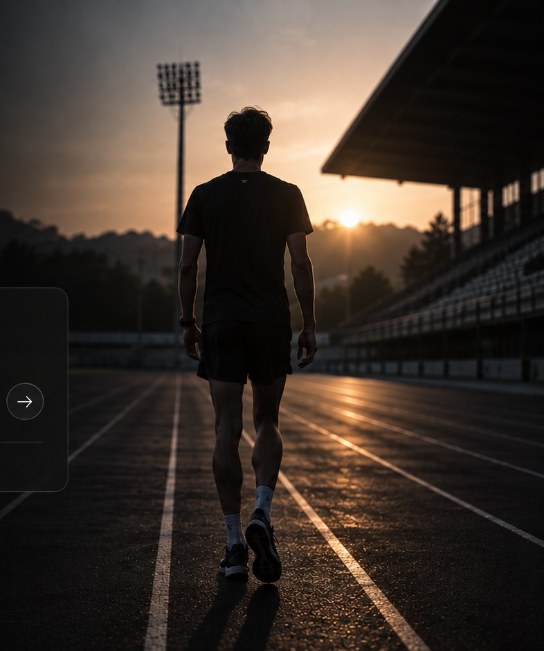 Atleta de costas numa pista, diante da luz do nascer do sol